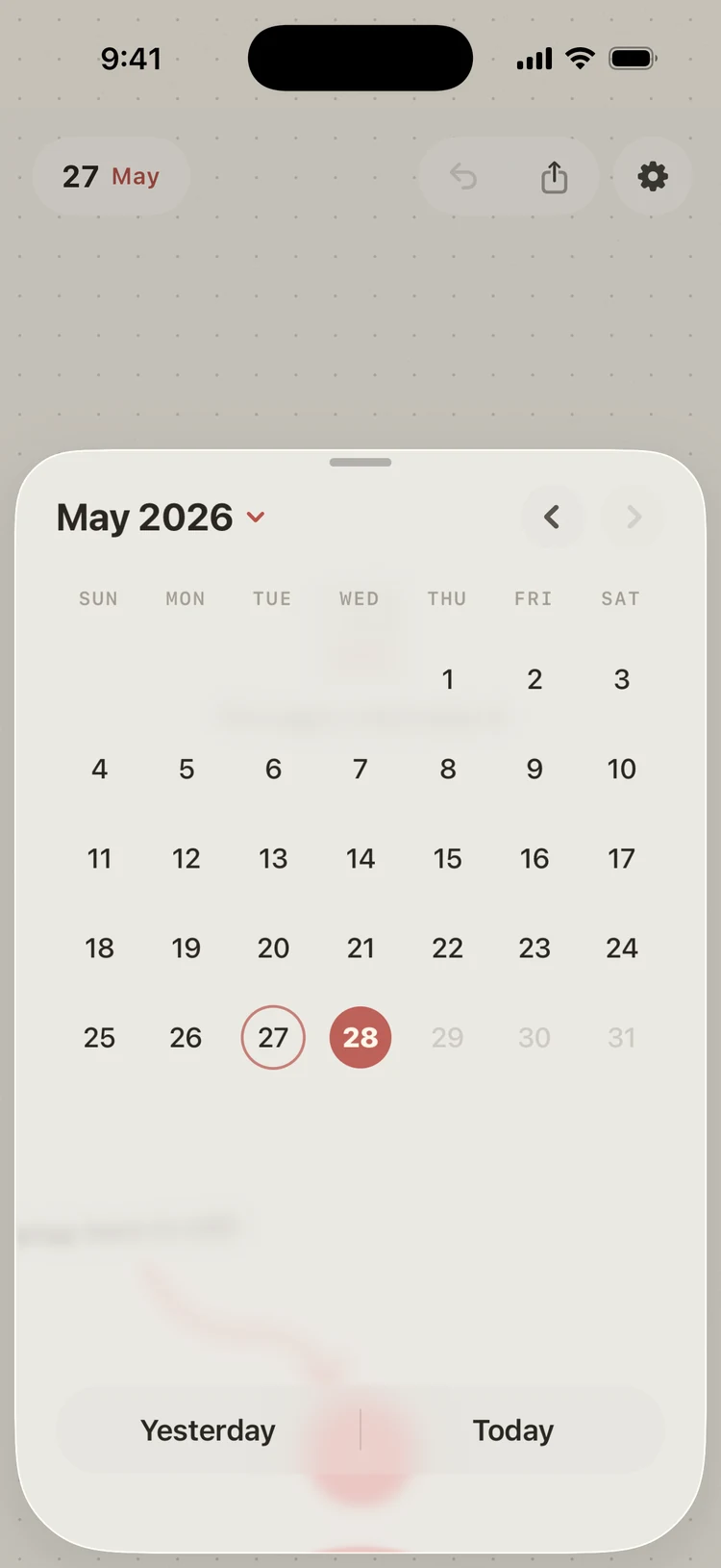 The calendar sheet for May 2026, open over a diary page